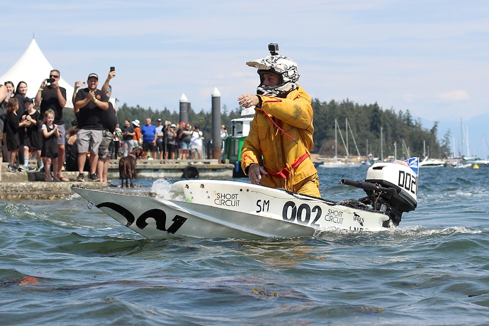 Trevor Short reaches the beach first at the Great International World Championship Bathtub Race on Sunday, July 28.