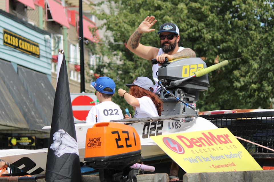 Anthony Cordeiro waves to the crowd at the parade. (Karl Yu/News Bulletin)