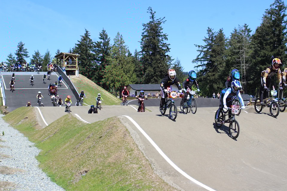 Nanaimo BMX Association riders take their 'flag lap' to open a day of racing Sunday, May 4, at the Marie Davidson BMX Park. (Greg Sakaki/News Bulletin)