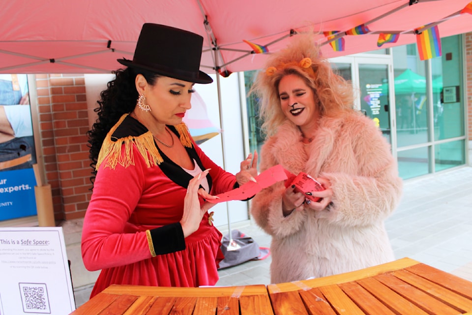 Dany Loyer and Lindsay McGuire sell tickets for carnival games at Cirque du So-Gay in Nanaimo May 10. (Karl Yu/News Bulletin)