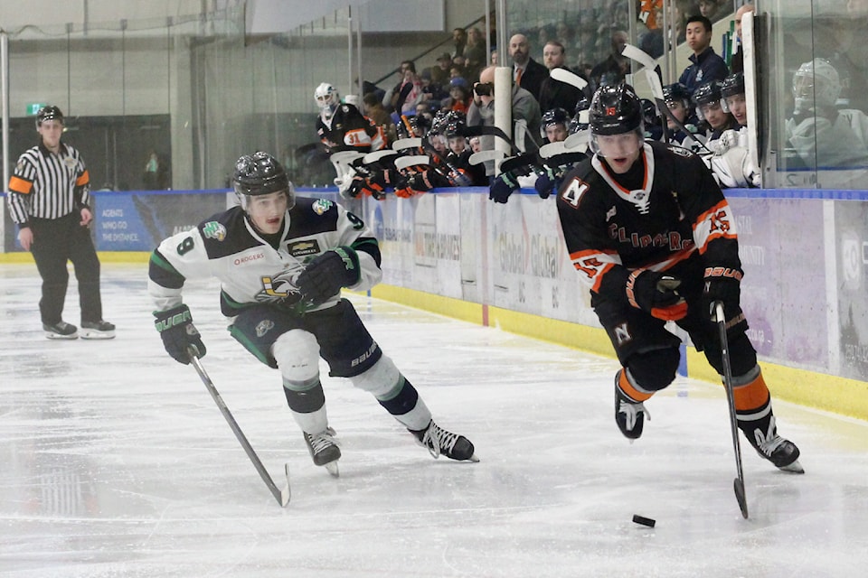 Surrey Eagles player Ryan Evenhuis, left, chases Nanaimo Clippers player Dylan Kinch during a game Saturday, March 29, at Frank Crane Arena. (Greg Sakaki/News Bulletin)