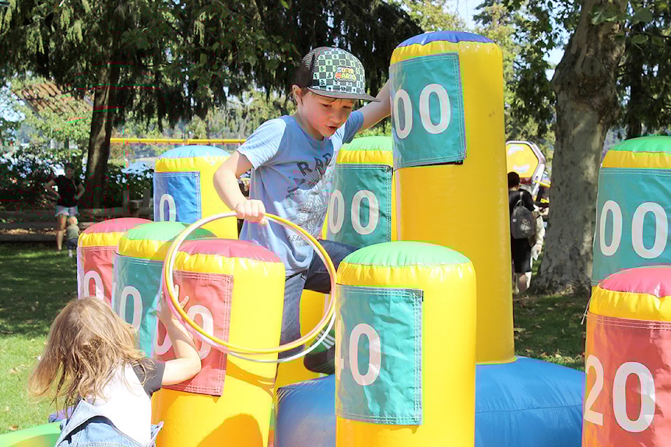 Alexander MacDonald and other children play on the inflatable ring toss at Nanaimo Family Fun Day at Maffeo Sutton Park on Sunday, Sept. 1.