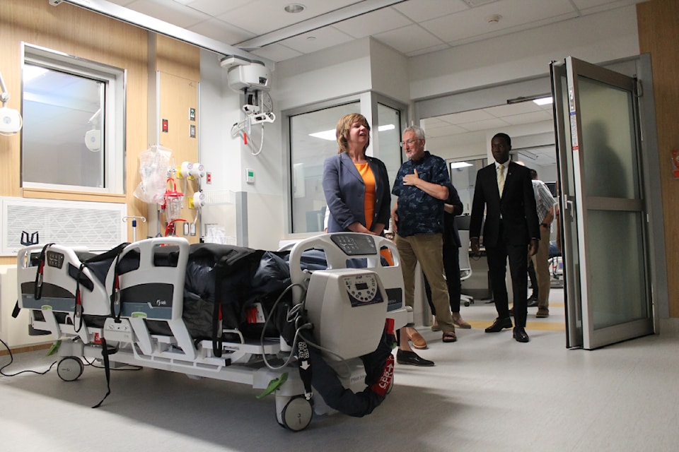 Stakeholders including Nanaimo-Gabriola MLA Sheila Malcolmson, Mayor Leonard Krog and Nanaimo-Lantzville MLA George Anderson visit the new high-acuity unit at Nanaimo Regional General Hospital. (Jessica Durling/News Bulletin)