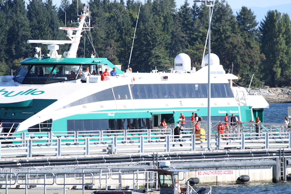 Passengers board a Hullo ferry before the vessel's maiden voyage on Aug. 16, 2023.