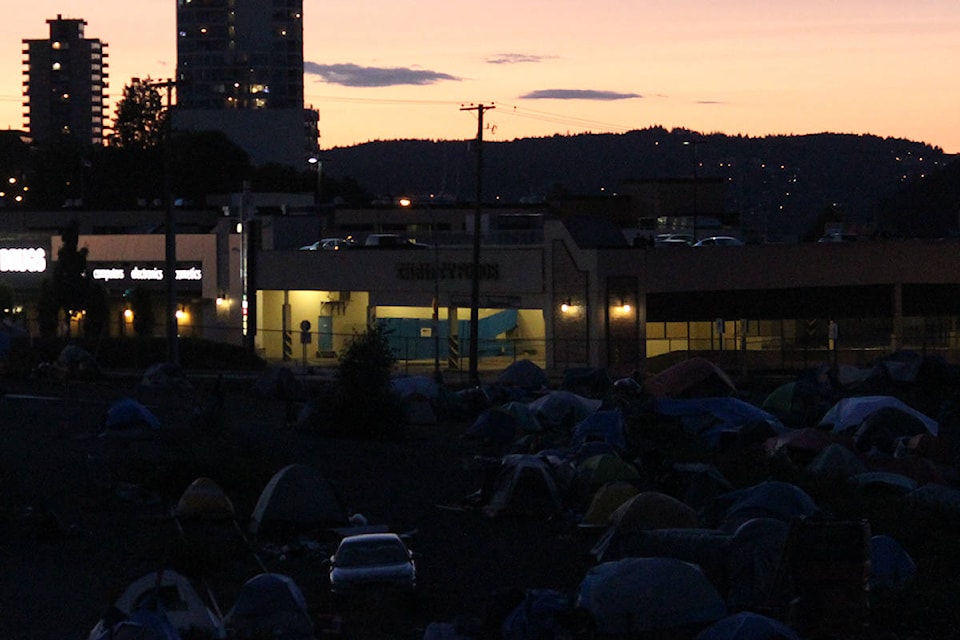 13741669_web1_181002-NBU-tent-city-machete-arrest_1