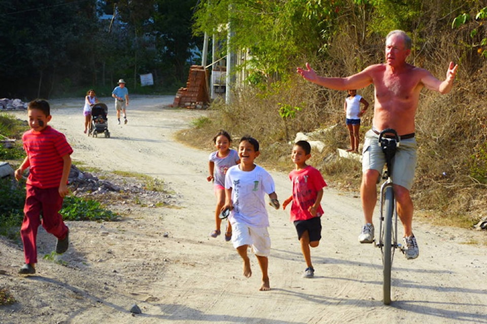 White Rock’s Dal Fleischer riding his unicycle in Mexico. Fleischer as part of a miniature circus school for children in the country. (Contributed photo)