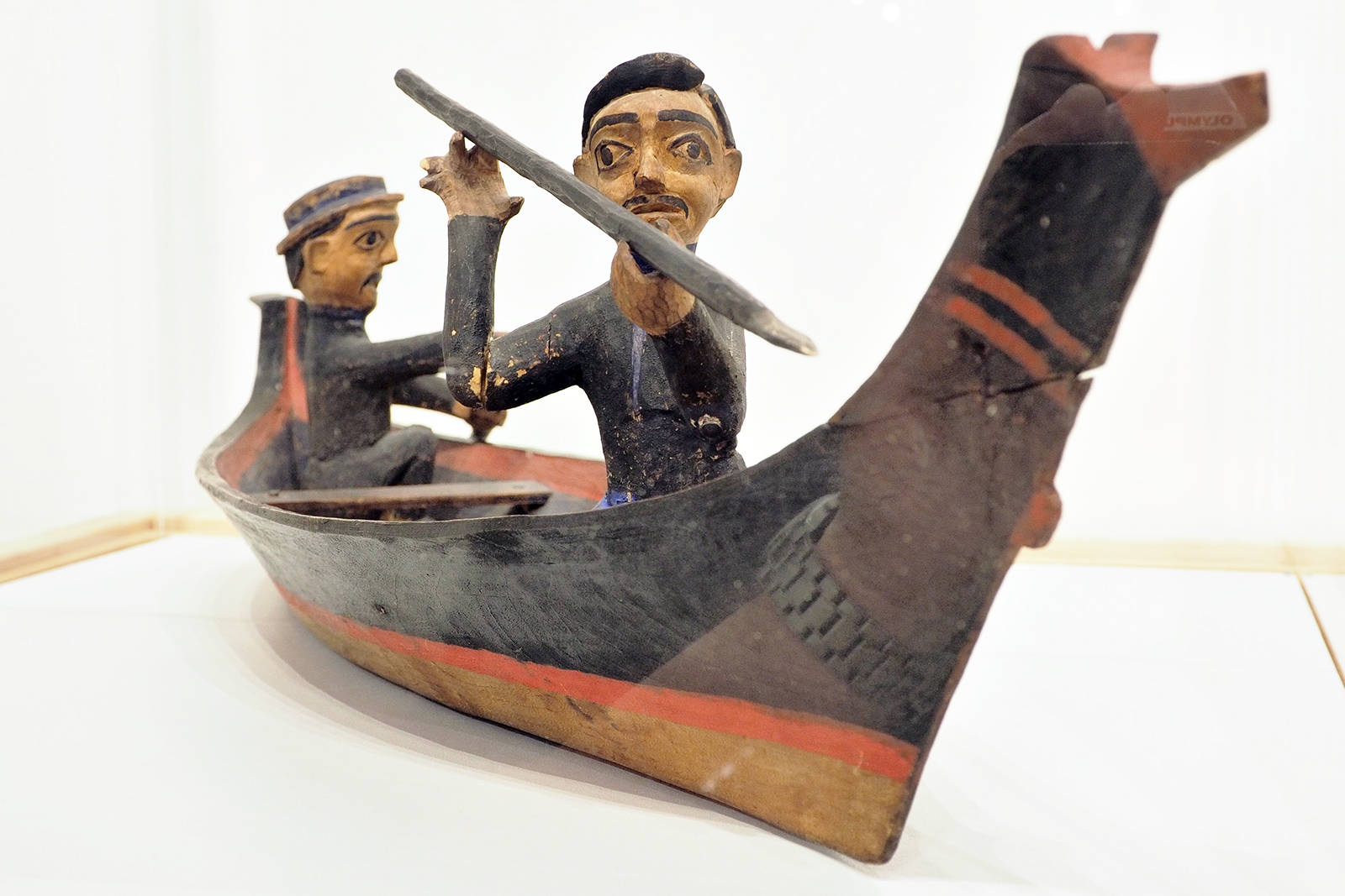 A First Nations carving from the early 1900s portrays two men hunting in a whaling canoe and is part of the display focusing on Snuneymuxw culture in Nanaimo Museums From the Vault exhibit. (Chris Bush/News Bulletin)