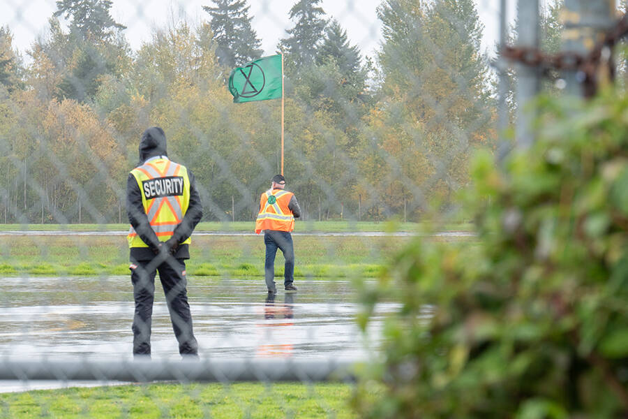 One man was arrested after walking onto the Nanaimo Airport tarmac as part of an Extinction Rebellion protest on Oct. 25 (Photo by Tyler Hay)