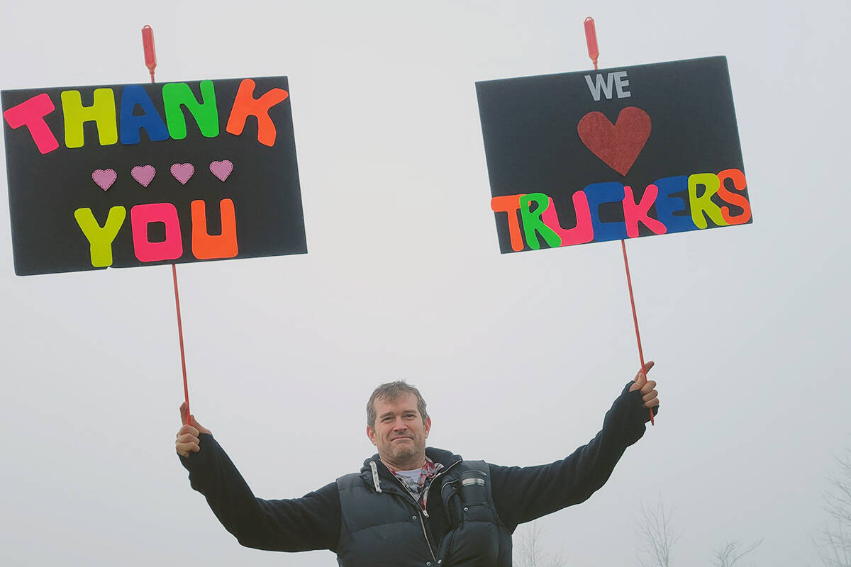 Frank from Maple Ridge was among several hundred demonstrators who lined Hwy. 1 and the 264th St. overpass in Aldergrove Sunday morning, Jan, 23, to show support for a convoy of truckers protesting a vaccine mandate. (Dan Ferguson/Langley Advance Times)