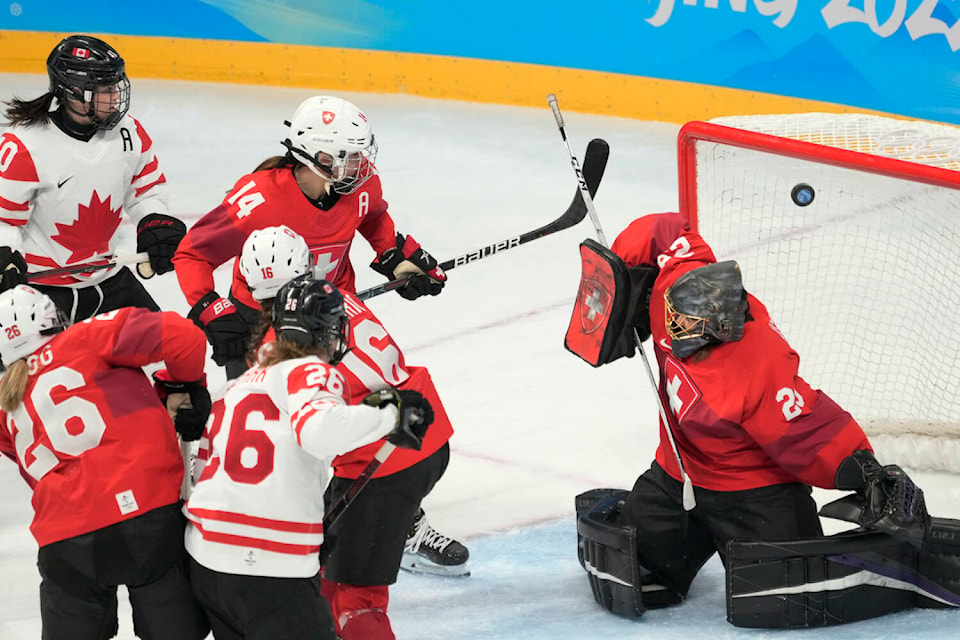 Canada forward Emily Clark (26) scores on Switzerland goaltender Saskia Maurer during second period women’s ice hockey semifinals action Monday, February 14, 2022 at the 2022 Winter Olympics in Beijing. THE CANADIAN PRESS/Ryan Remiorz