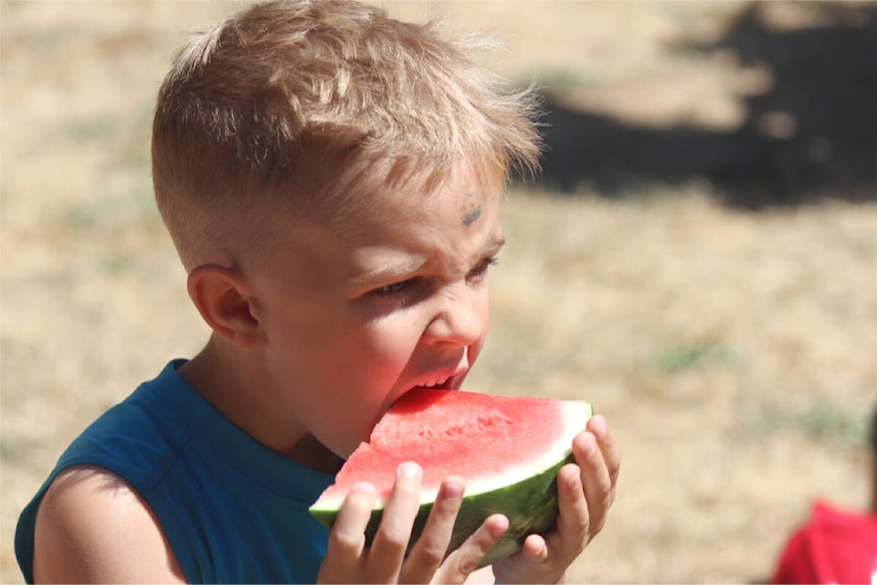 Weston Hewer successfully defended his watermelon-eating contest title in the preschool-Grade 1 division at Lantzville Minetown Day. (Karl Yu/News Bulletin)