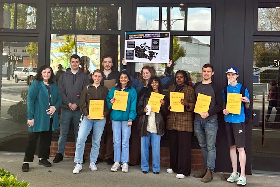 Organizer Manvi Bhalla (fifth from left) and a delegation of youths deliver 90 cover letters applying for a yet-to-be-created “Youth Climate Corps” to constituency manager Bernadette Kudzin (left) outside Delta MP Carla Qualtrough’s constituency office in Ladner on Monday, May 8, 2023. (Submitted photo)