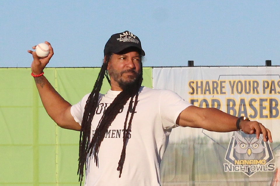 Former major league slugger Manny Ramirez throws a ceremonial pitch at a game between the Nanaimo NightOwls and Victoria HarbourCats on Thursday, June 20, at Serauxmen Stadium.