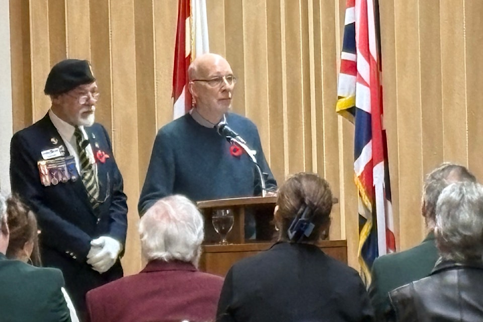 Lew Forth, left, and Gary Osborne eulogize Victor Osborne at a memorial service in Nanaimo on Sunday, March 16. (Karl Yu/News Bulletin)