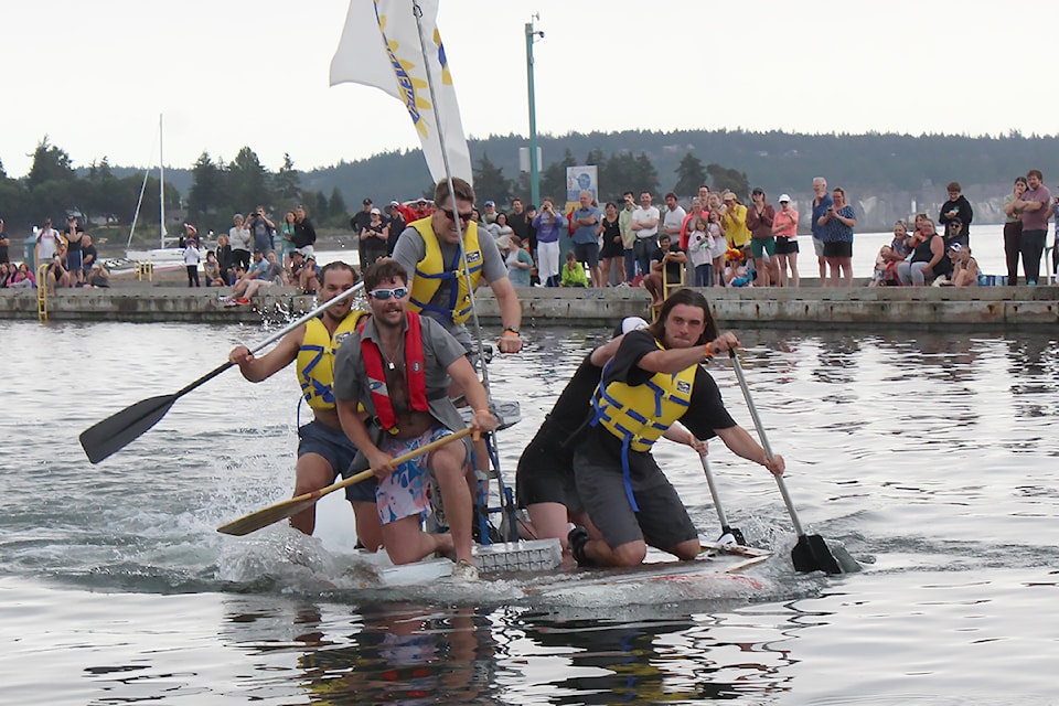 Ross Manson, Chris Ilyn, Scott Manson, Brendon Landry and Sydney Saunderson power the Rotary Club boat to victory at the Silly Boat Regatta