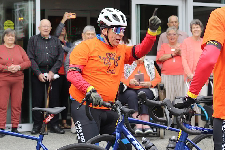 Nanaimo RCMP Const. Ian George leads his Cops for Cancer Tour de Rock teammates in a cheer before leaving Berwick on the Lake retirement residence Monday, Sept. 30. (Greg Sakaki/News Bulletin)