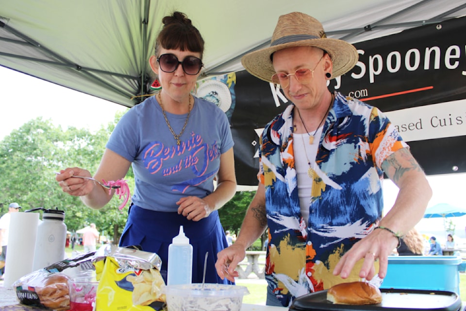 Christina Avery and Radford Cowan of Knifey Spooney, from Kingston Ont., prep food at VegFest Nanaimo. (Karl Yu/News Bulletin)