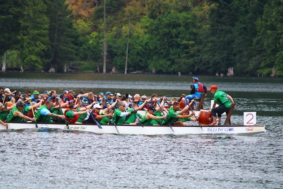 Nanaimo Dragonslayers (in green) and Victoria Canoe and Kayak Club Dragonflyers compete at Westwood Lake on July 19. (Karl Yu/News Bulletin)