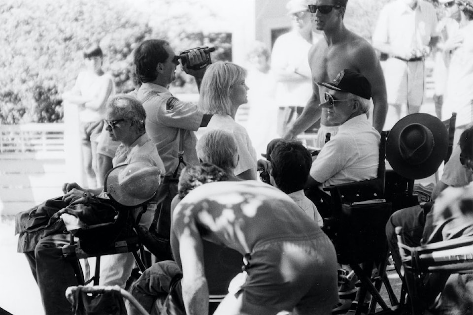 In this classic photo, we can see Steve Martin, alongside other cast and crew, working on the set of Roxanne in 1986. 