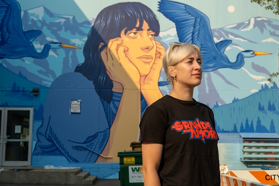 Lidia Cao says the face in her mural, Mountain Soul, is "like me, a bit, and it is about myself and my love of nature, both here and in my home town." The new mural is on the back of the Nelson and District Community Complex.
