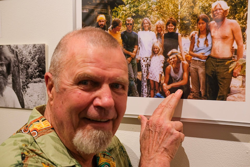 At the opening of the  Nelson Museum exhibit entitled Utopia Unveiled, Moss Holland of Nelson points out his younger self as part of a commune in the Slocan Valley in the 1960s.