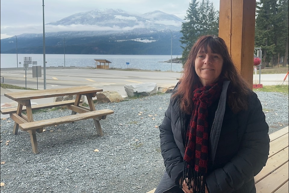 Megan Rokeby-Thomas outside her business Ladybug Coffee, with the Kootenay Bay ferry landing in the background. 