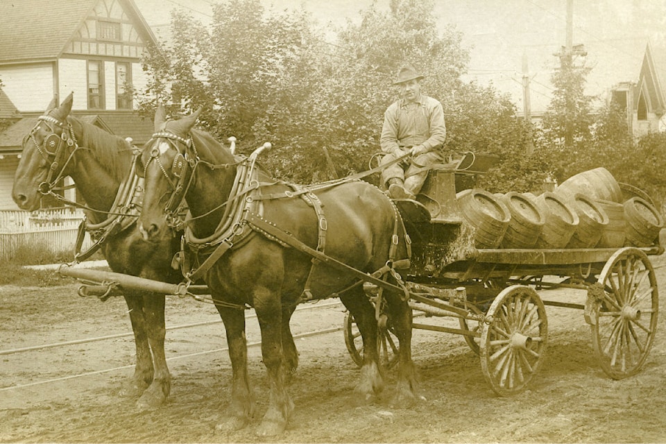 A delivery likely containing beer barrels makes its way along a Nelson street, circa 1911. The Nelson Brewing Company employed a horse drawn wagon to supply Nelson patrons and assist with shipping to outside towns and camps.
