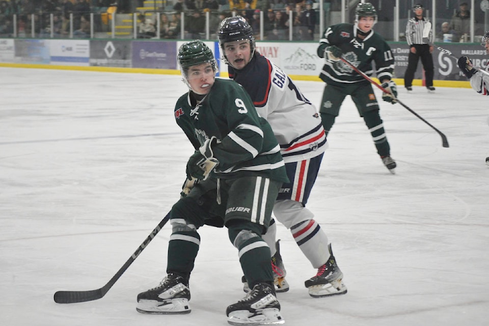 Nelson forward Kieran Christianson fends off Sicamous's Ashton Gallagher during the Leafs' 3-2 win Friday.