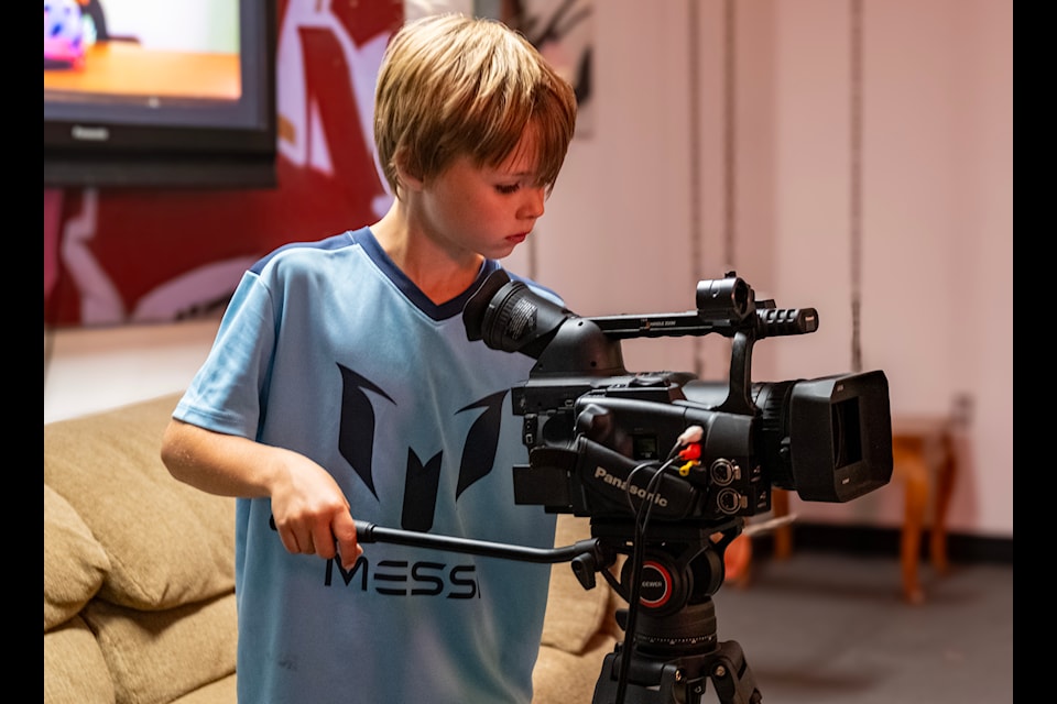 Oliver Panton learns to use a video camera at the Nelson and District Youth Centre. 
