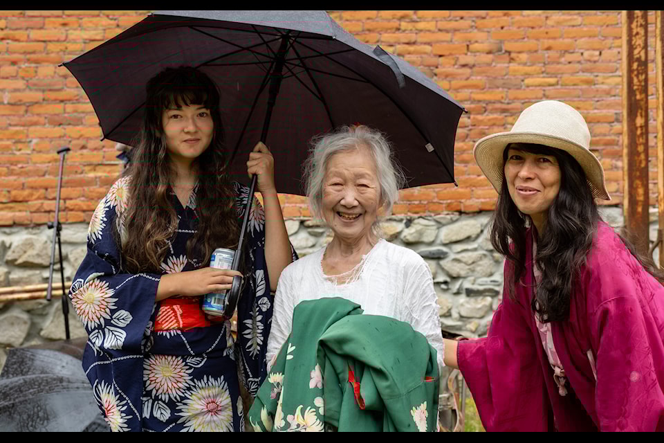 Tsuneko Kokubo (centre) with Aurora Garrick Rice (left) and Manna Garrick Rice following a performance by Kokubo and Paul Gibbons at the opening of the Window to the Past exhibit in Sandon on July 19.