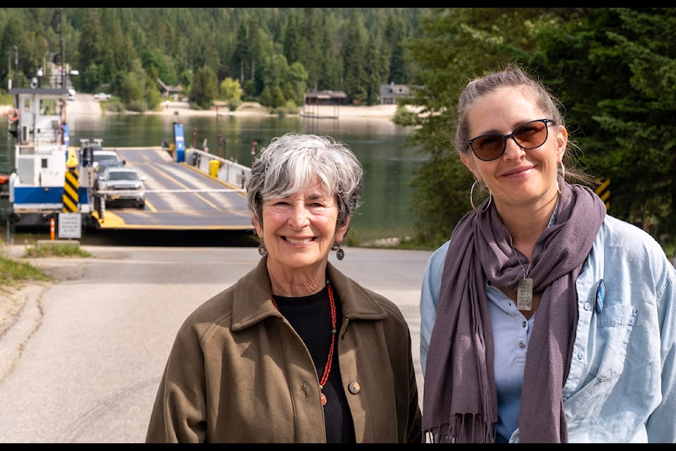 Ina Pockrass (left) and Melinda Foot, members of the Harrop-Procter Ferry Society, at the ferry landing in June 2025.