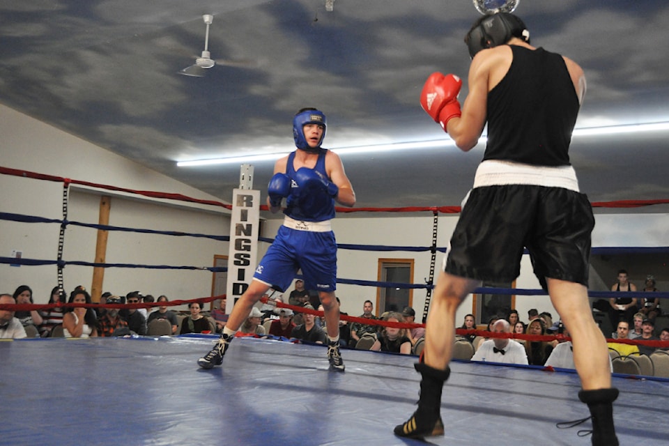 Nelson's Torin Edmonds (in blue) won the main event of Fight Night 15 on June 28.