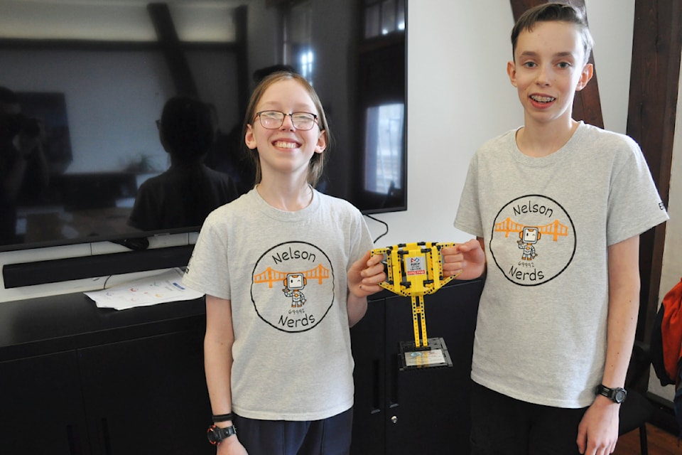 Kasper Breisnes (left) and Eric Bibby show off the First Lego League Challenge trophy they won at the B.C./Yukon provincials. The Balfour residents will compete at the world championship in Houston, Texas, in April.