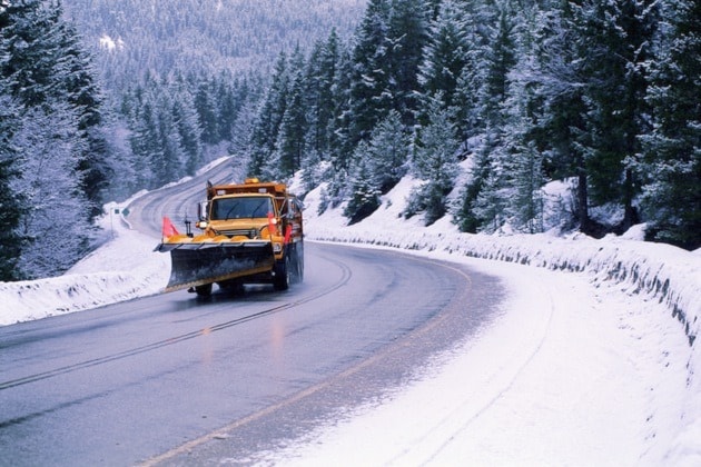 Snowplow on winter road