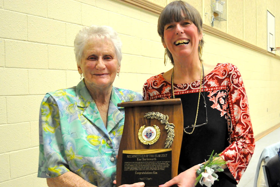 Kim Charlesworth (right) accepted the 2017 Citizen of the Year award from 2016 winner Helen Jameson on Friday. Photo: Tyler Harper