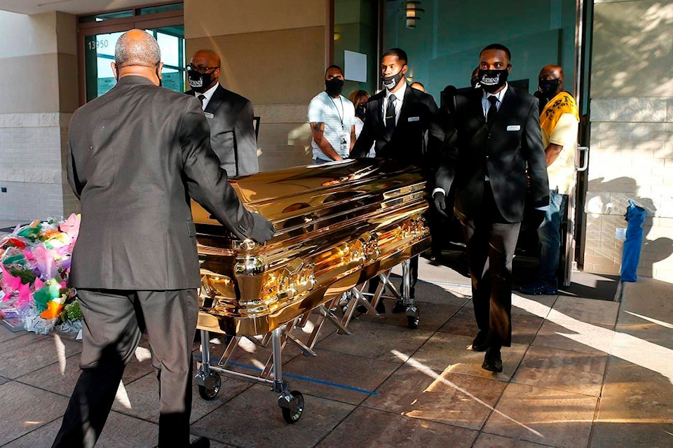 George Floyd’s casket is brought out of Fountain of Praise church following a public visitation Monday, June 8, 2020, in Houston. Floyd died May 25 after being restrained by Minneapolis police officers. (Godofredo A. Vásquez/Houston Chronicle via AP, Pool)