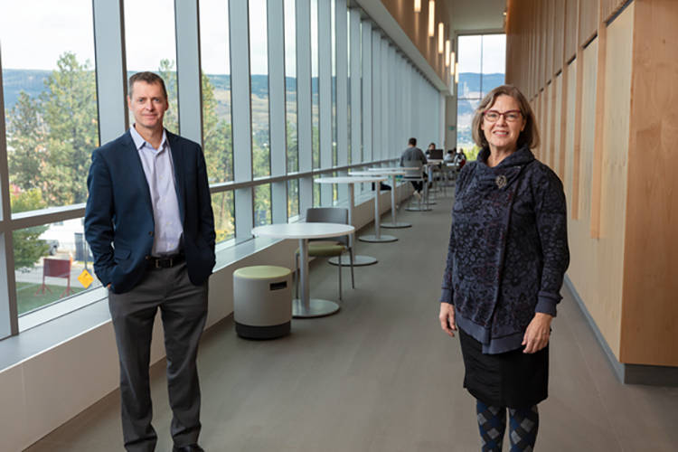 Glen McIntyre, Thermal Energy Manager, UBCO, and Juan Rincon, Key Account Manager, FortisBC, tour the utilities area of the Commons building at the UBCO campus.