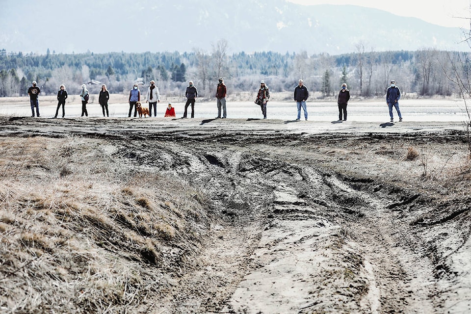 A group of concerned citizens looking for government action at the Brilliant Flats gathered recently for a walk of the area. Photo: Jennifer Small