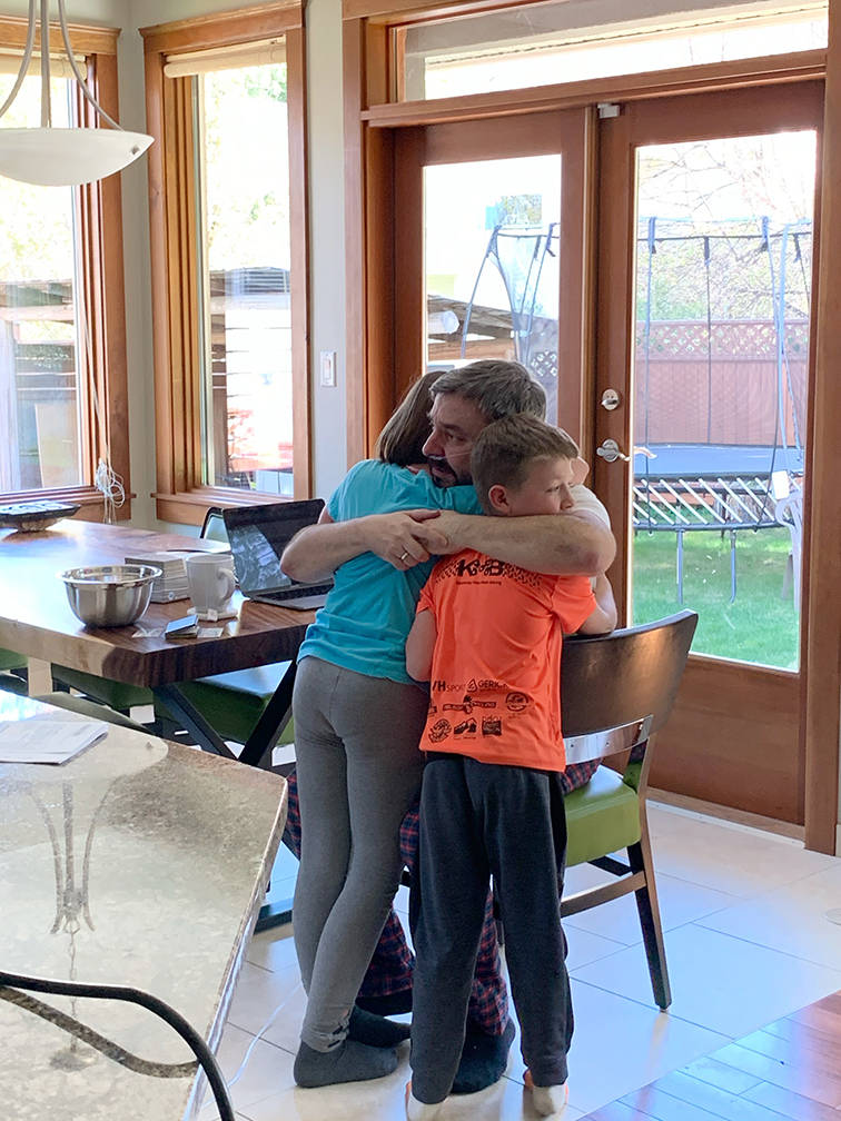 Kristina Little took this photo of the moment her children first saw their father Rob after he returned home from hospital. It makes me cry almost every time I look at it, she says.