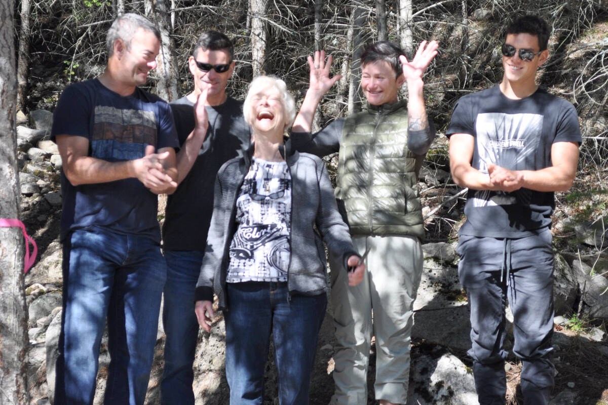 Heather Lyon (centre) celebrates with her family after cutting the ribbon on Lyons Bluff, a new trail first conceived of by Don Lyon in 2009 that just opened on Sept. 25, 2021. Photo: Tyler Harper