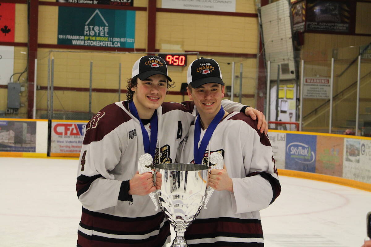 Will McPhee and Carson Reinson with the Teck Cup. (Josh Piercey/Revelstoke Review)