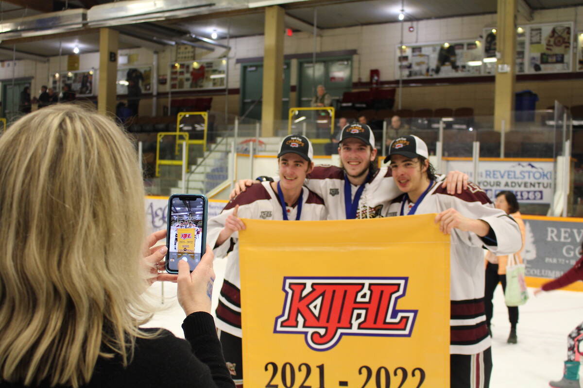 Getting a photo with the banner that will hang in the Revelstoke Forum. (Josh Piercey/Revelstoke Review)
