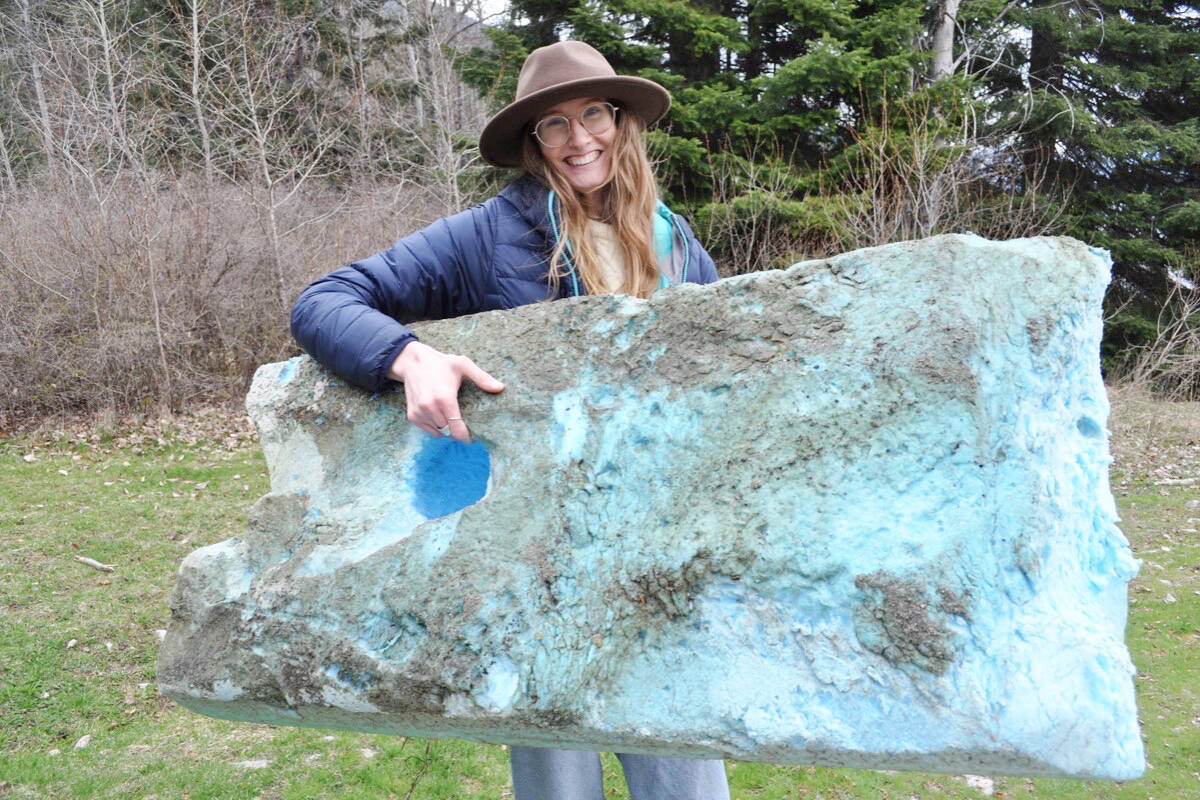 Joelle Burnie with the Friends of Kootenay Lake holds a piece of foam taken out of the water. Photo: Tyler Harper