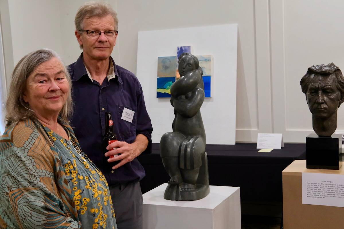 Former DTUC students Monica Carpendale and Cam Douglas with two of his sculptures. Photo: Bill Metcalfe