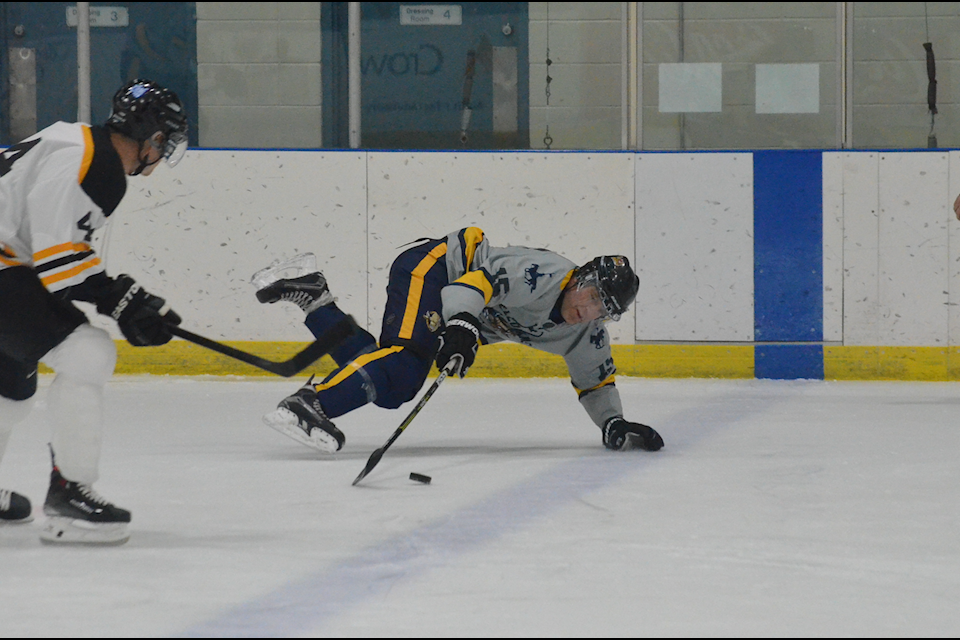 Andrew Moore of the RCMP has a misadventure with the blue line during the YKFD-RCMP charity hockey game at the Multiplex on Wednesday. James McCarthy/ϳԹ photo