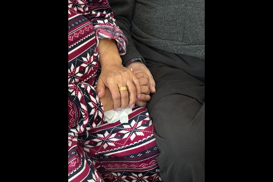 Max and Julia Trennert hold hands.