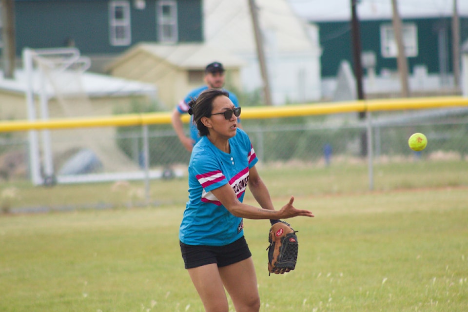 Outfielder Jessie Pascal throws a ball back towards the diamond during the first annual Barry Jacobson Memorial Tournament, which ran July 26 to 28. A huge gathering of athletes and fans came out for the three day tournament to pay their respects for Barry.