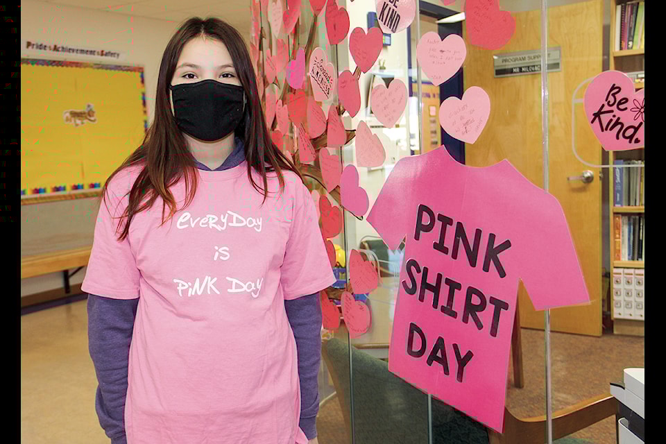 Keira Durocher models the shirt that was worn by students at Princess Alexandra School in 2021 for Pink Shirt Day. NNSL file photo