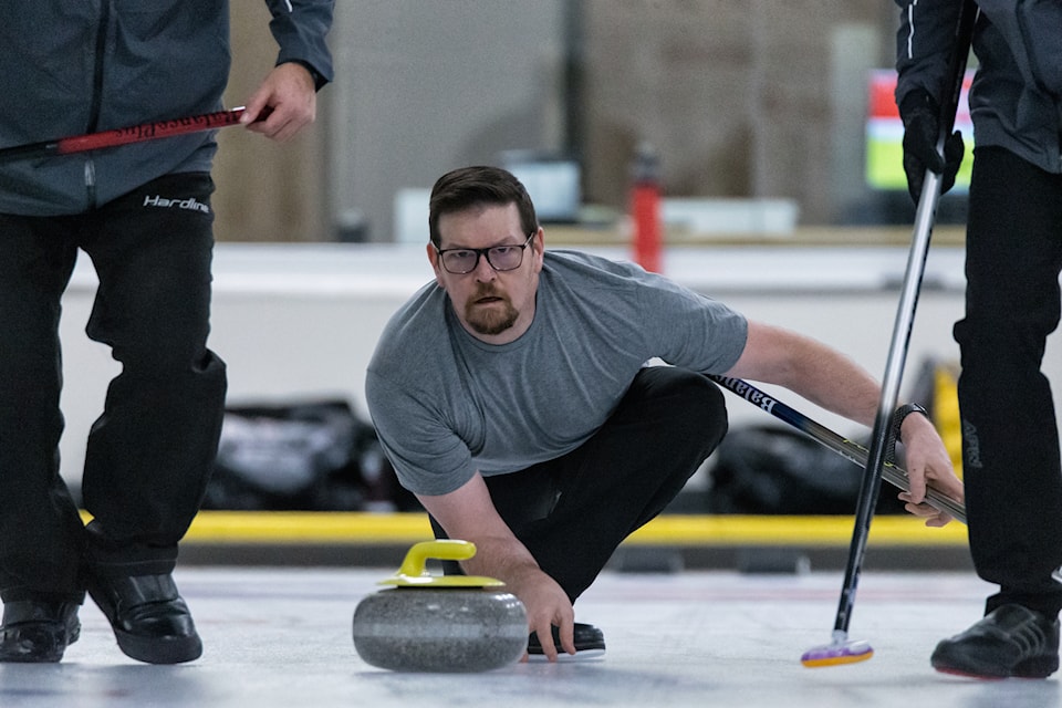D'arcy Delorey delivers one of his thirds' stones during action in the NWT Men's Curling Championship in Hay River on Feb. 1. Photo courtesy of Thorsten Gohl