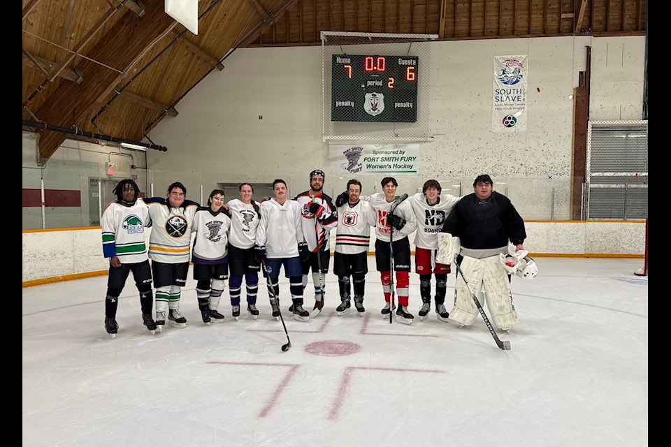 Team Ethan poses for a photo after winning Fort Smith's 2024 Christmas Classic hockey tournament. From left, the team was composed of Jaquan Blythe, Ryan Schaefer, Alex James, Gaylen Pischinger, Trey Beck, Justin Borque, Brandon Boyd, Kole Laviolette, Jacob Carroll, and goalie Ethan Walsh. Photo courtesy of Bret Moore